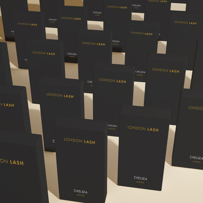 many black london lash extension trays standing in a few rows
