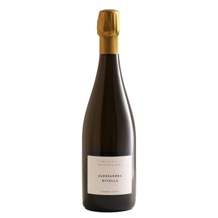 Sparkling wine bottle with gold foil capsule and front label on dark glass