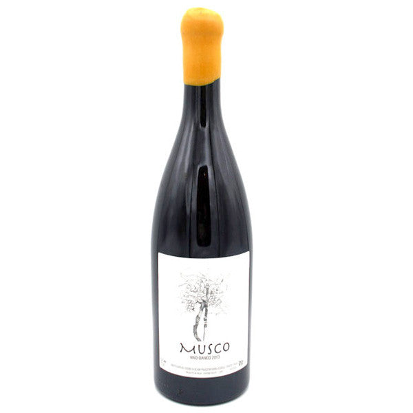 White wine bottle, black glass with yellow cork and white Musco label