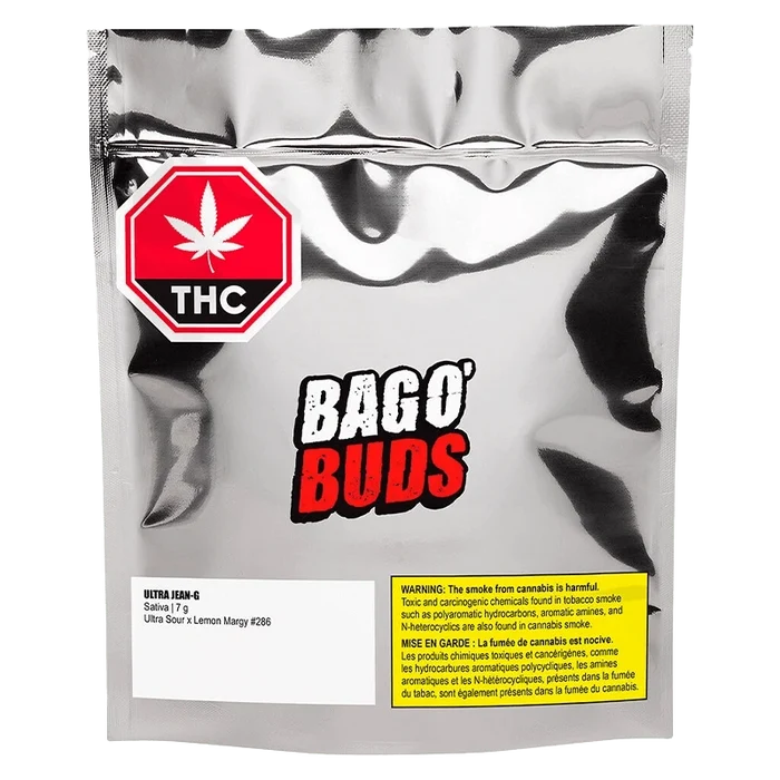 Close-up of the "Ultra Jean-G" packaging, featuring bold typography and a cannabis leaf against a dark background.