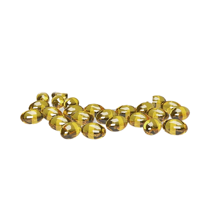 A scattered arrangement of 3 000 CBD Softgels, with a glossy, transparent finish catching the light in a studio shot.