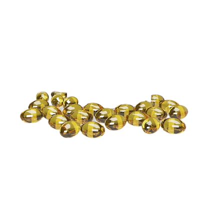 A scattered arrangement of 3 000 CBD Softgels, with a glossy, transparent finish catching the light in a studio shot.