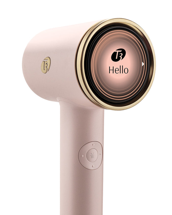 Pink and gold hair dryer with brand logo on a white background