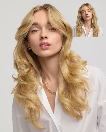 Woman with long blonde hair wearing a white shirt on a light gray background