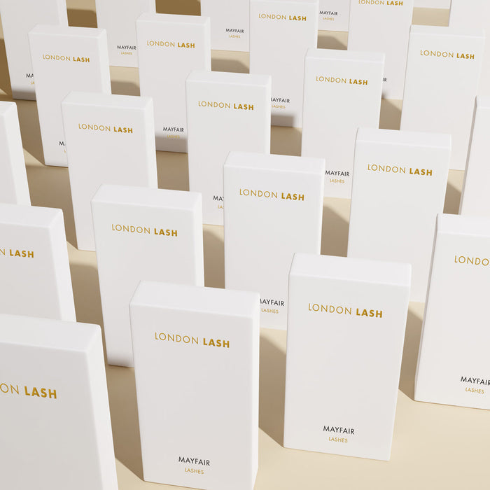 many white london lash  mayfair eyelash extension trays placed in a row
