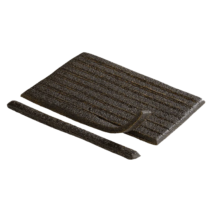 A close-up, angled view of the Captain Kush Rip Strips, showcasing their dark, rectangular shape against a neutral background.