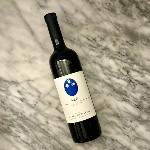 Carpineti Nzu Red 2020 wine bottle tilted, blue Nzu label