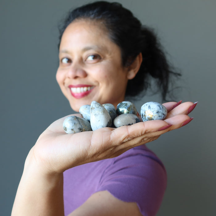 sheila of satin crystals holding Snow Quartz Chalcopyrite Tumbled Stone Set