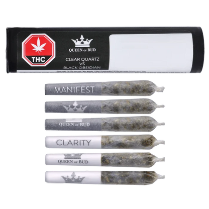 Top-down view of six pre-rolls and a black-and-white tube labeled "Clear Quartz Vs Black Obsidian Diamond Infused PR 6 x 0.25 g" by Queen of Bud.