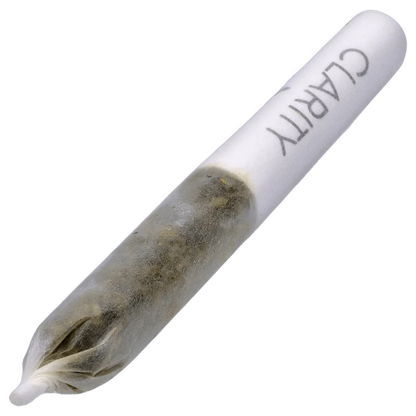 Angled close-up of a rolled joint labeled "Clear Quartz Vs Black Obsidian Diamond Infused PR 6 x 0.25 g" showing the twisted tip and packed herb through translucent paper.