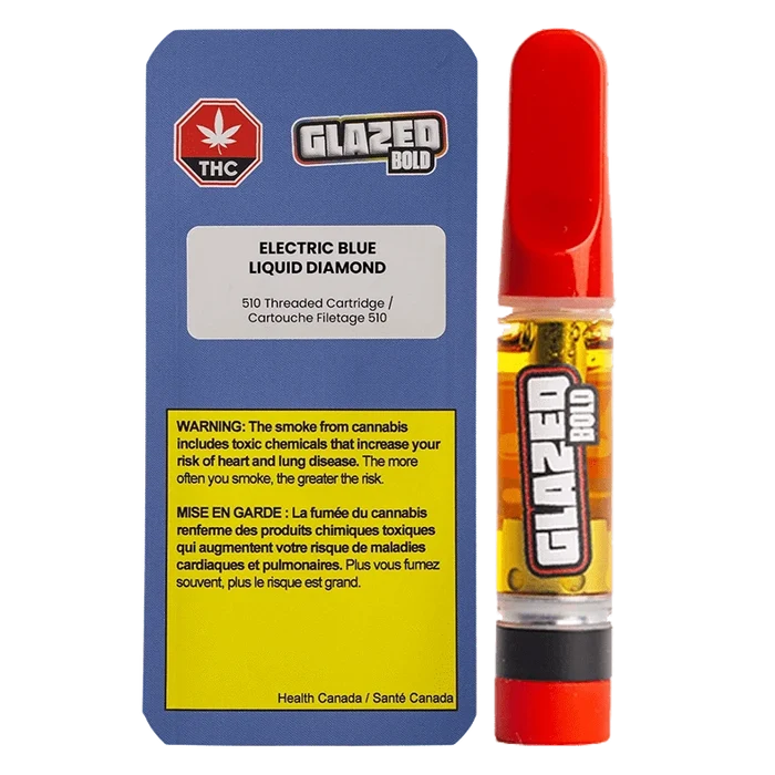 Front-facing shot of the Electric Blue Diamonds Vape Cartridge beside its blue warning card, the cartridge showing amber oil and a red mouthpiece.