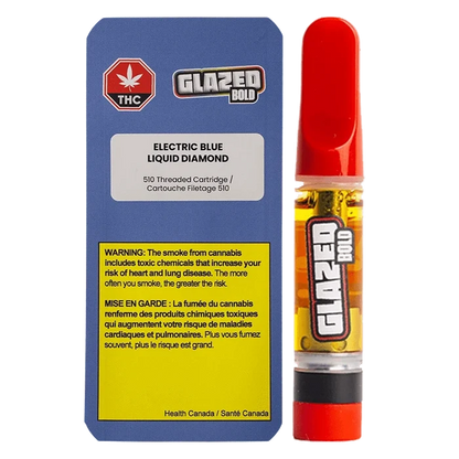 Front-facing shot of the Electric Blue Diamonds Vape Cartridge beside its blue warning card, the cartridge showing amber oil and a red mouthpiece.