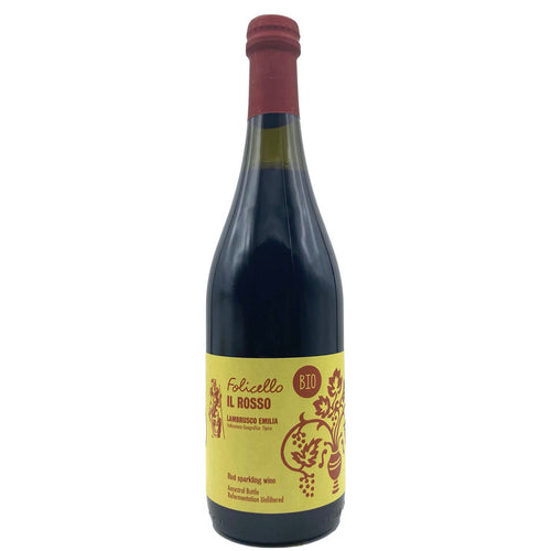 Wine bottle with dark glass, red foil cap, and yellow label