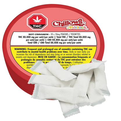 Top-down view of a red round tin labeled Hot Cinnamon Chillows Pouches with several white fabric pouches fanned across the foreground.