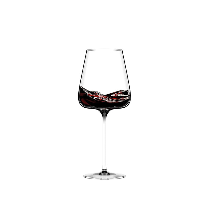 Stemmed wine glass with dark red swirling decoration on the bowl