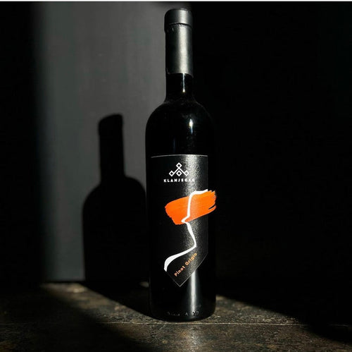 Klanjscek Pinot Grigio Ramato wine bottle, dark glass with orange label and seal