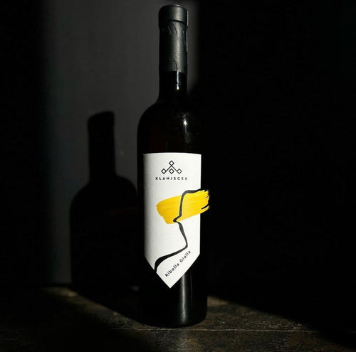 Klanjscek Ribolla Gialla 2018 wine bottle with cream label and yellow graphic.