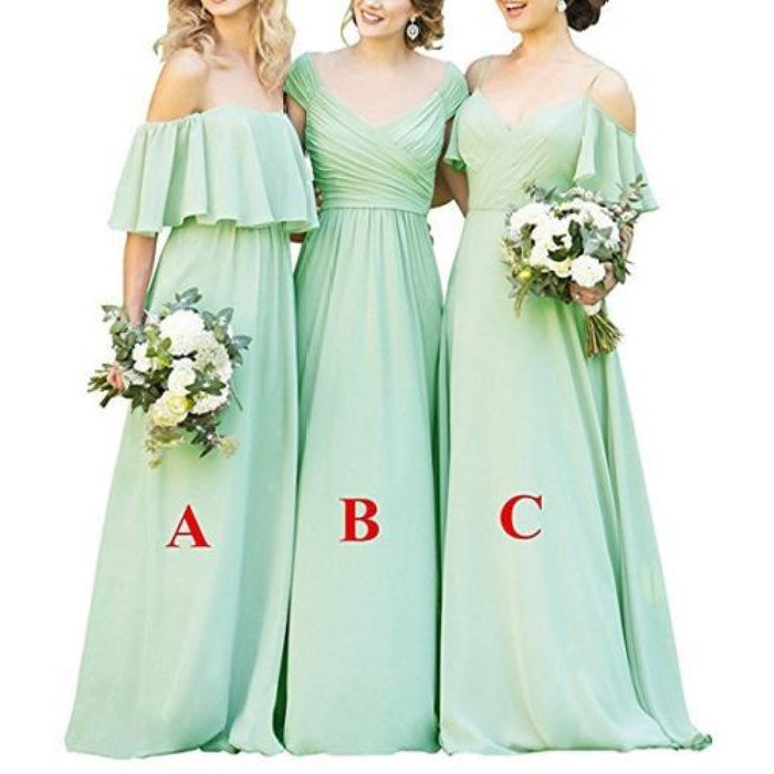 Three elegant long chiffon bridesmaid dresses in mint green with floral bouquets