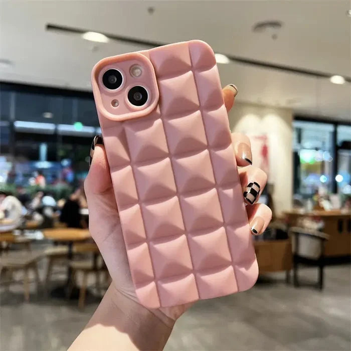A woman holding a pink phone case