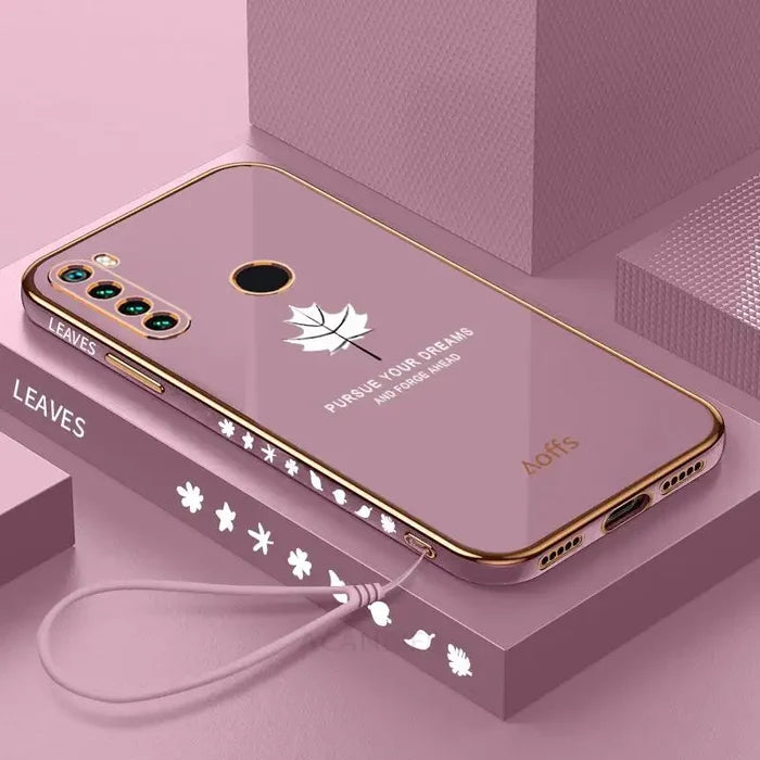 a pink phone case with a white maple leaf design
