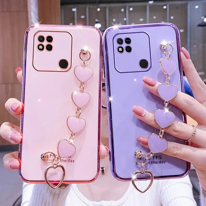 two phone cases with heart charms