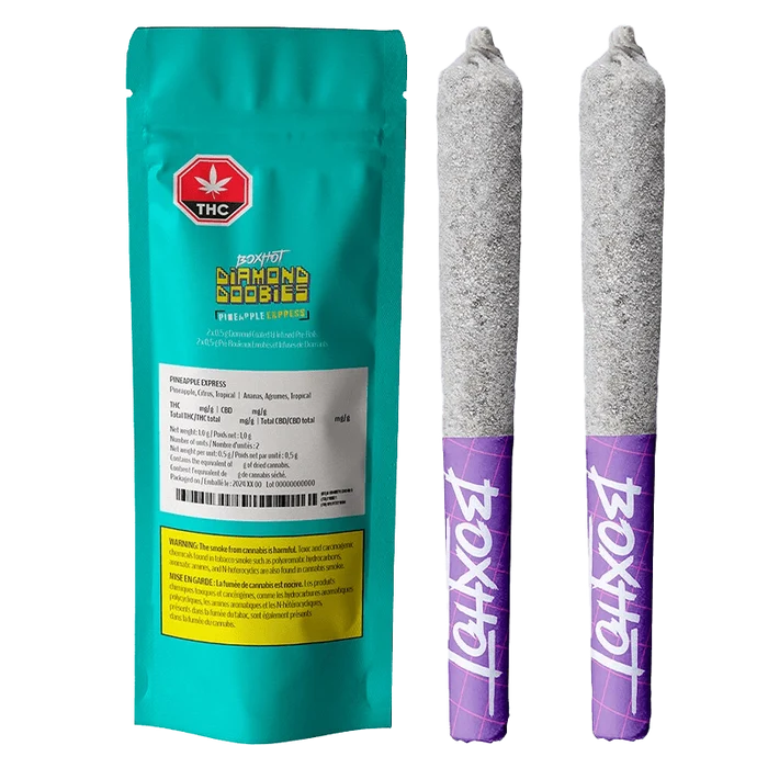 Close-up of the Pineapple Express Infused Pre Rolled 2 x 0.5 g packaging, displaying warnings and cannabis content details on a white label.