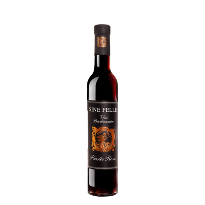 Dark red wine bottle with black cap; 'SINE FELLE' label and gold crest