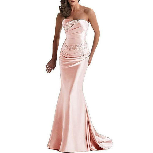 Elegant beaded mermaid evening dress in soft pink featuring a strapless design and fitted silhouette