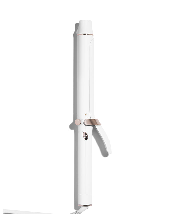 White hair curling iron on a white background
