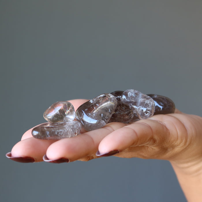 Smoky Quartz Tumbled Stones on model palm