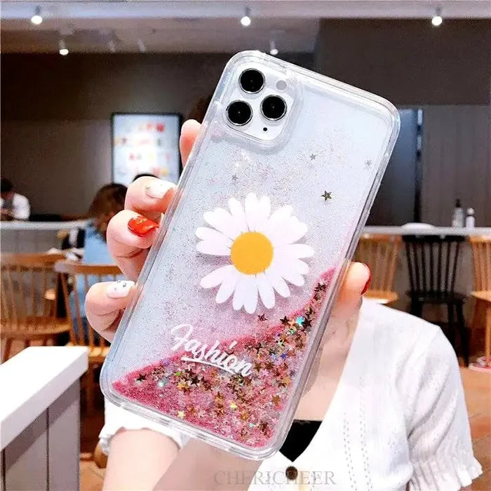 a woman holding a phone case with a flower on it